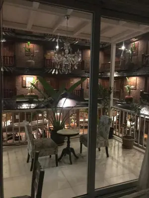 a dining room with a table and chairs at Oriental Smile Hotel in Bangkok