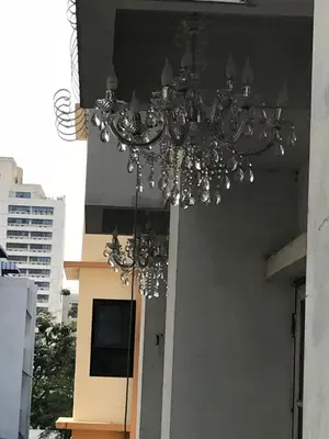 a chandelier hanging from the ceiling of a building at Oriental Smile Hotel in Bangkok