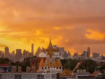 a building with a city in the background at Dinsomon Hotel in Bangkok