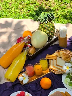 a tray of fresh fruits and vegetables on a blanket at The Silver Palm Wellness Resort in Bangkok