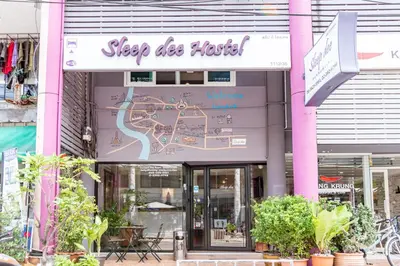 a building with a sign that reads sleep disco hotel at Sleep Dee Hostel in Bangkok