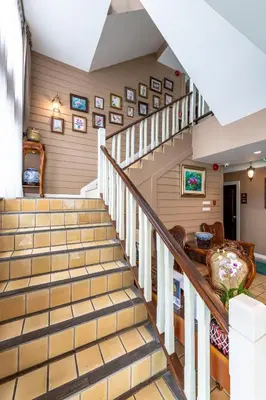 a staircase in a home with wooden walls at The Orchid House 153 in Bangkok