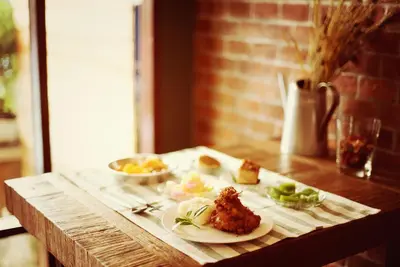 a table with two plates of food on it at Yoo Yen Pen Sook in Bangkok
