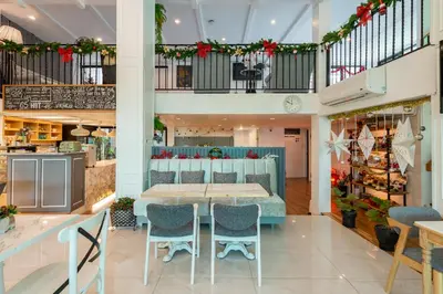 a dining room with a table and chairs at White Ivory Bed And Breakfast in Bangkok
