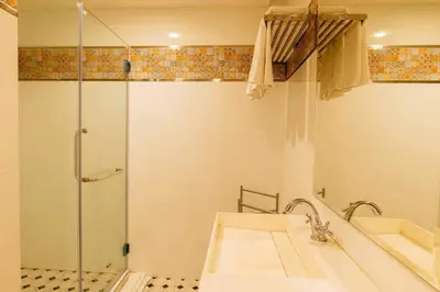 a bathroom with a shower and a sink and a tub at Nine Design Place in Bangkok