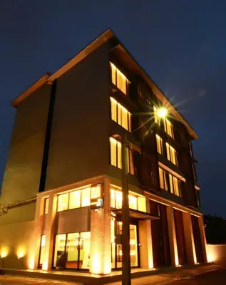 a building with a street light in front of it at The Bangkok Major Suite in Bangkok