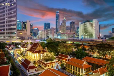 a city skyline at night with tall buildings at Banthat Thong Hostel in Bangkok