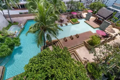 an overhead view of a swimming pool with a resort at Century Park Hotel in Bangkok