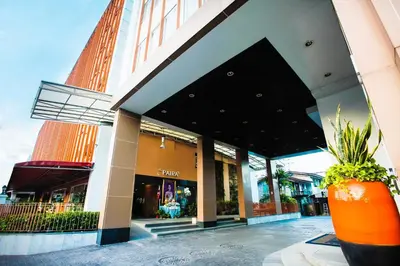 an orange vase sitting in front of a building at The Patra Hotel - Rama 9 in Bangkok