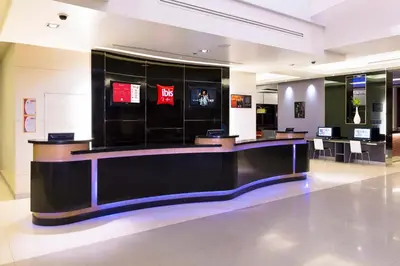 a large lobby with a counter in a store at Ibis Bangkok Sukhumvit 4 in Bangkok