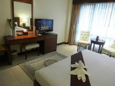 a room with a living room with a room at De Arni Bangkok - SHA Extra Plus in Bangkok