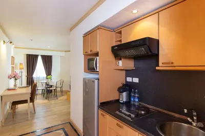 a kitchen with a sink and a counter top at Riverfront Bangkok in Bangkok