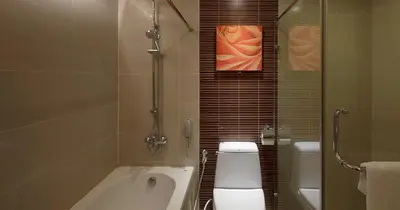 a bathroom with a tub and a toilet and a shower at Grand Richmond Stylish Convention Hotel in Nonthaburi