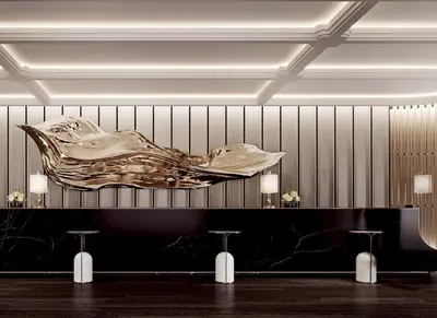 a lobby with a large gold fish on the wall at Fairmont Bangkok Sukhumvit in Bangkok