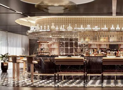 a restaurant with a bar with a lot of glasses at Fairmont Bangkok Sukhumvit in Bangkok