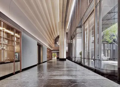 a hallway of a building with a tub and windows at Fairmont Bangkok Sukhumvit in Bangkok