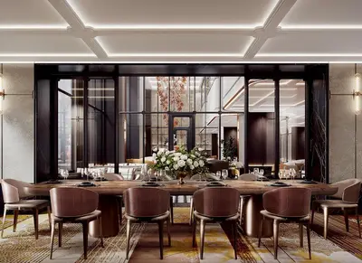 a dining room with a large table and chairs at Fairmont Bangkok Sukhumvit in Bangkok