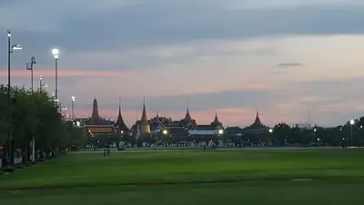 a view of a park with a building in the background at Villa Mungkala in Bangkok