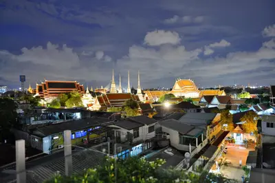 a city skyline at night with buildings and mosques at Riva Arun Bangkok in Bangkok
