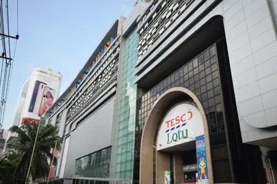 a building with a sign on the side of it at Blissotel Ratchada in Bangkok