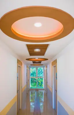 a hallway in a building with a circular ceiling at Sunset Residence Pinklao in Bangkok
