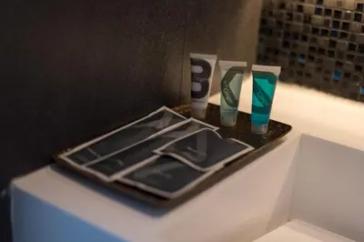 a tray with two toothbrushes and two toothbrushes at Grand 5 Hotel & Plaza Sukhumvit Bangkok in Bangkok