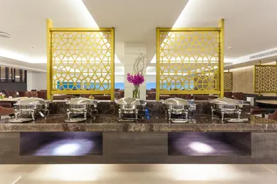 a buffet at the lobby of a hotel at Grand 5 Hotel & Plaza Sukhumvit Bangkok in Bangkok