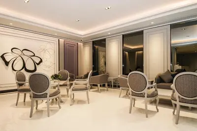 a room with chairs and a table and a couch at imm hotel Ladprao Bangkapi Bangkok in Bangkok