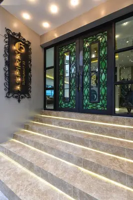 a set of stairs with stained glass windows at Aspira G Sukhumvit 33 in Bangkok
