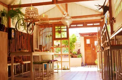 a large room with a porch with a door and a room with a porch at Pailin Guest House in Bangkok