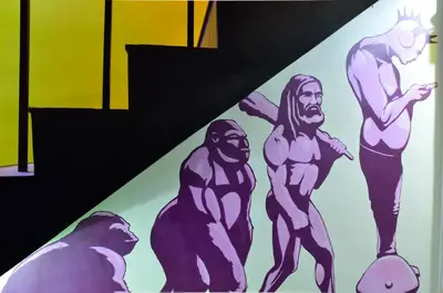 a painting of superheroes on a wall at Maderla in Bangkok