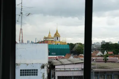 a view of a city from a window at Methavalai Residence Hotel in Bangkok