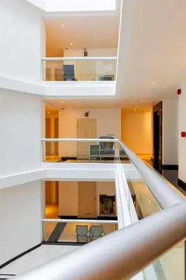 an open stairway in a building with chairs at Sukhothai Residence Ruam Ruedi in Bangkok
