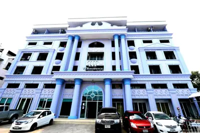 a building with cars parked in front of it at T3 Residence in Bangkok