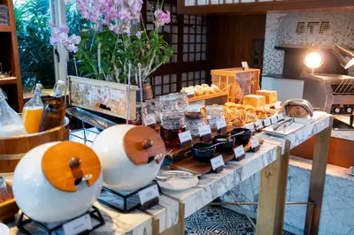 a table with bottles of honey and other products on it at 137 Pillars Residences Bangkok in Bangkok