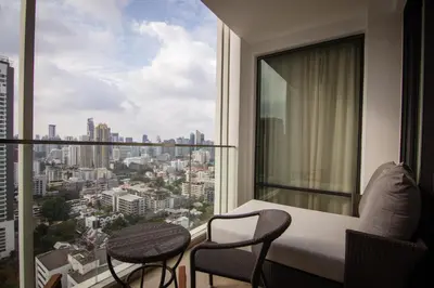 a hotel room with a view of a city at 137 Pillars Suites Bangkok in Bangkok