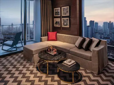 a living room with a couch and a table at 137 Pillars Suites Bangkok in Bangkok