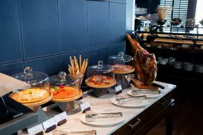 a buffet with many plates of food on a table at 137 Pillars Suites Bangkok in Bangkok
