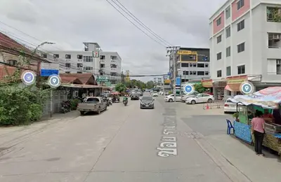 a city street with cars driving down the street at ลีลาวดี รามอินทรา - Leelawadee Resotel Raminthra 23 in Bangkok