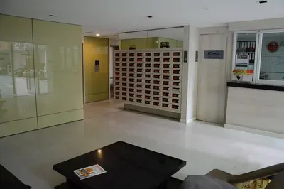 a room with a table and a wine rack at 1BR Condo 5 Min to BTS 1000Mbps Fiber Wi-Fi great location in Bangkok