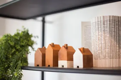 a group of wooden buildings sitting on a shelf at The Journey Hotel Laksi in Bangkok