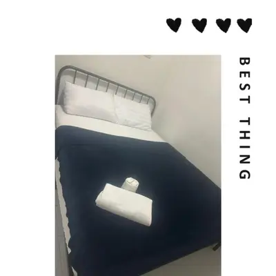 a bed with a roll of toilet paper on it at Bann Bunga Inn in Bangkok