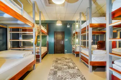 a room with a bunch of bunk beds at Hom Hostel & Cooking Club in Bangkok