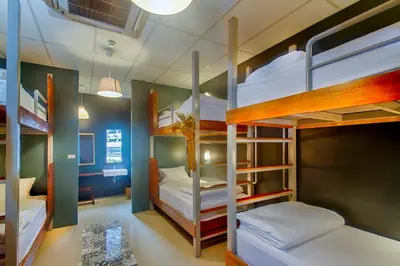 a bunk bed room with two bunk beds at Hom Hostel & Cooking Club in Bangkok