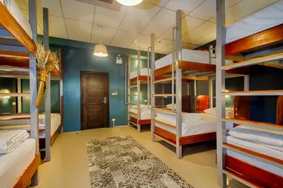 a room with bunk beds in a hostel at Hom Hostel & Cooking Club in Bangkok