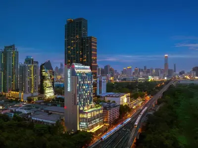 a city skyline at night with skyscrapers at Mercure Bangkok Makkasan in Bangkok
