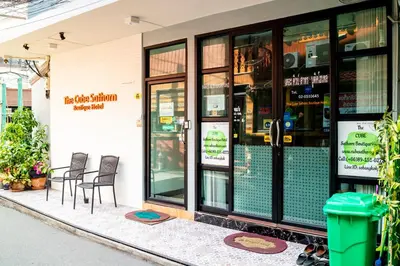 a store front with chairs and tables outside of it at The Cube Sathorn Boutique Hotel เดอะ คิวบ์ สาทร บูติค โฮเทล Near BTS Surasak in Bangkok
