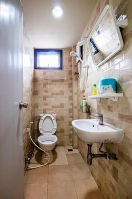 a bathroom with a toilet and a sink at The Cube Sathorn Boutique Hotel เดอะ คิวบ์ สาทร บูติค โฮเทล Near BTS Surasak in Bangkok