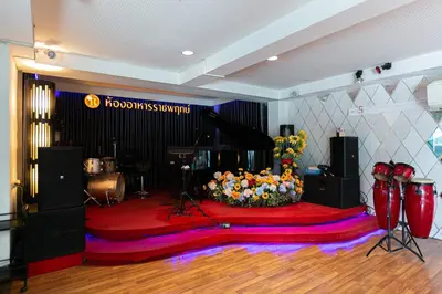 a room with a stage with a microphone and a keyboard at Grand Ratchapruek Hotel in Ban Bang Phlap