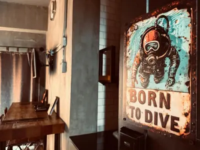 a sign that says born to dive in a kitchen at Rent V38 #420 friendly Thailand in Bangkok